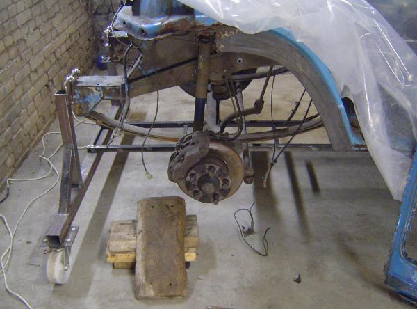 Front axis, its wheels removed, spine visible