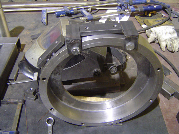 Lower bearing mount, with string connection plates being welded to its side